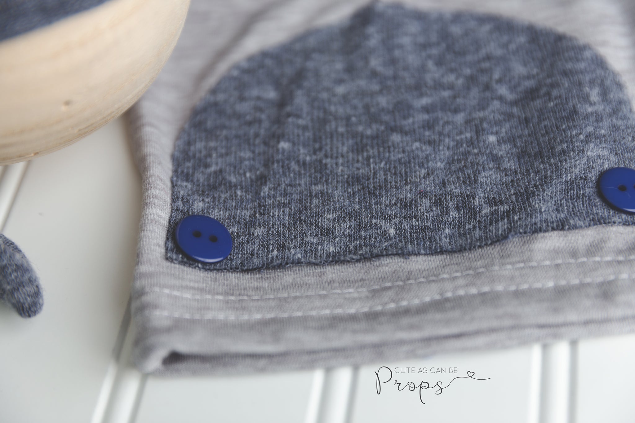 newborn gray pants with blue sleepy hat