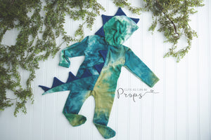 Newborn blue and green hooded dinosaur with blue spikes