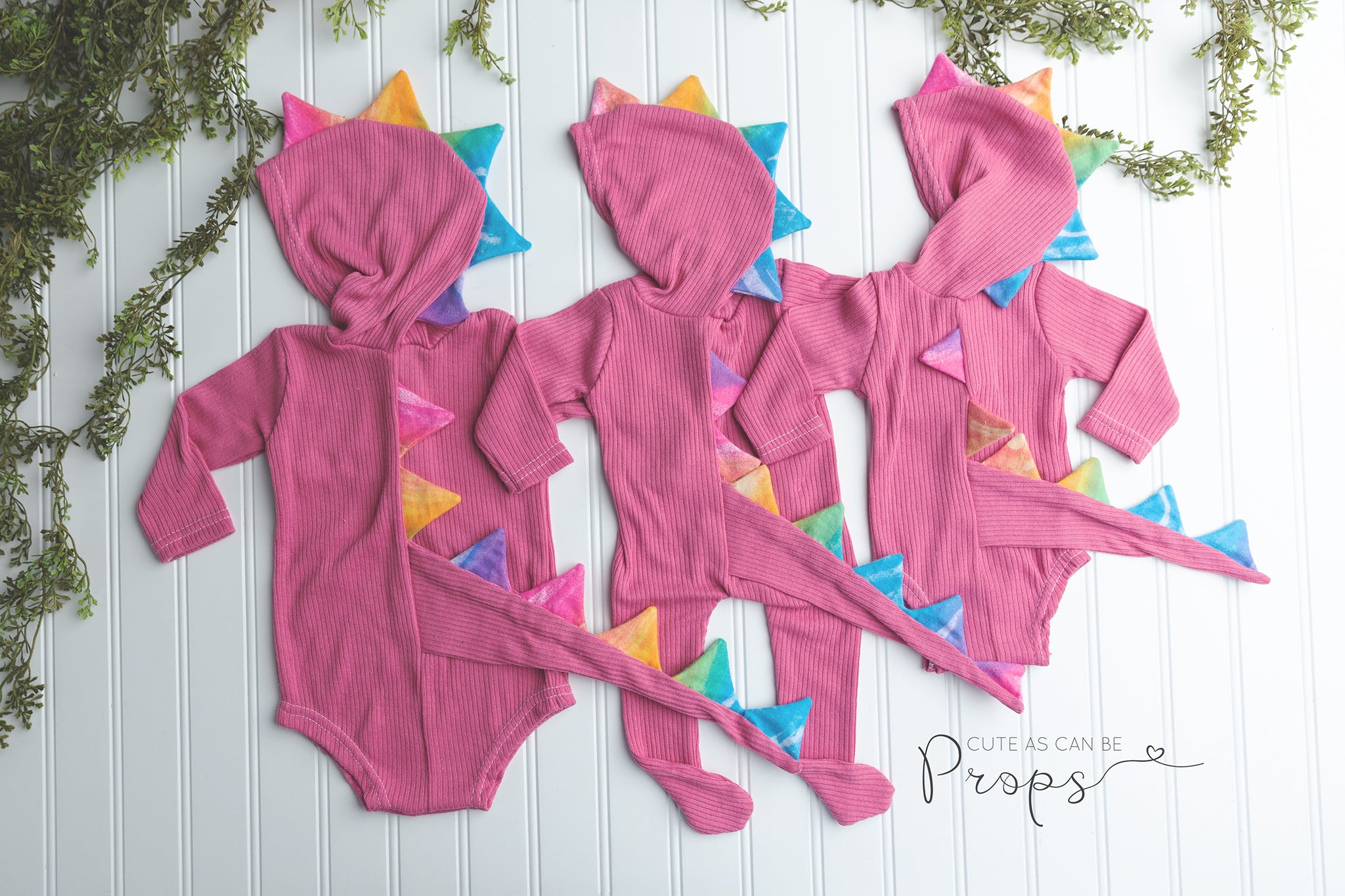Pink with rainbow hooded dinosaurs